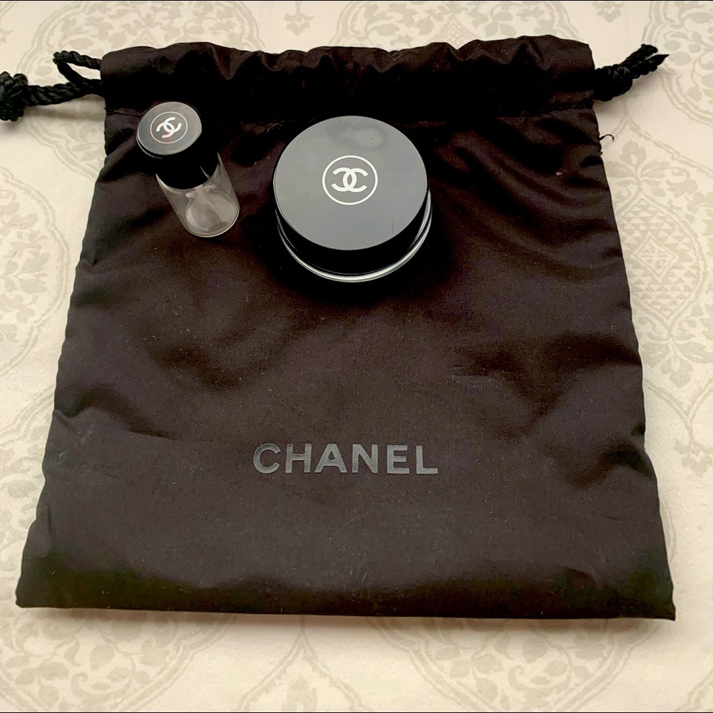 Chanel drawstring pouch with perfume and lotion glass travel jars.